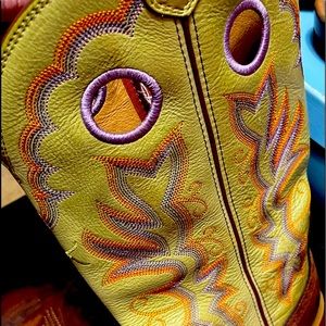 Worn once twisted X boots with tan leather on foot